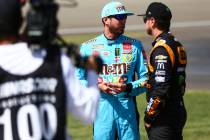 Kyle Busch, left, talks with Kurt Busch before qualifying for the Monster Energy NASCAR Cup Ser ...