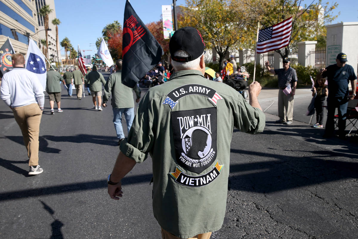 Army veteran Steve Sorensen, 70, of Alden, Minn., marches in the Veterans Day Parade in downtow ...
