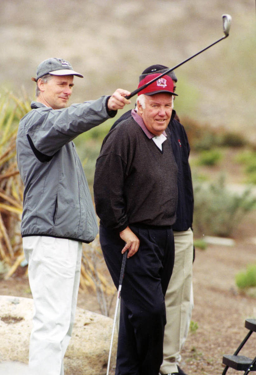 ESPN anchor and former UNLV quarterback Kenny Mayne plays golf with John Robinson, the Rebels' ...