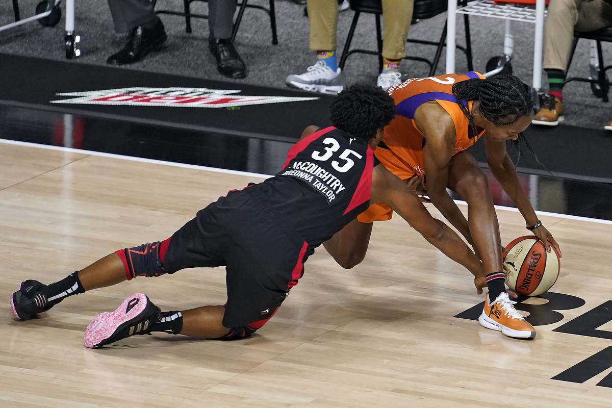 Las Vegas Aces forward Angel McCoughtry (35) and Phoenix Mercury guard Shatori Walker-Kimbrough ...