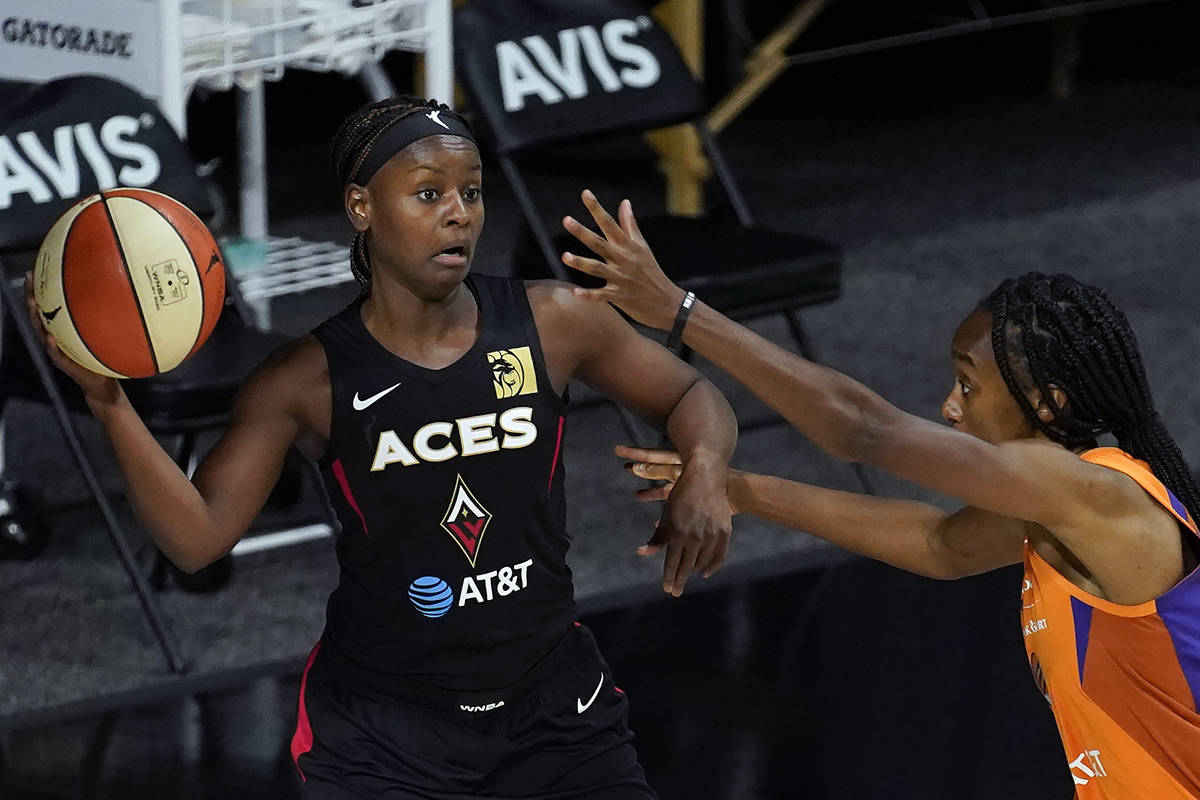 Las Vegas Aces guard Sugar Rodgers (14) passes the ball in front of Phoenix Mercury guard Shato ...