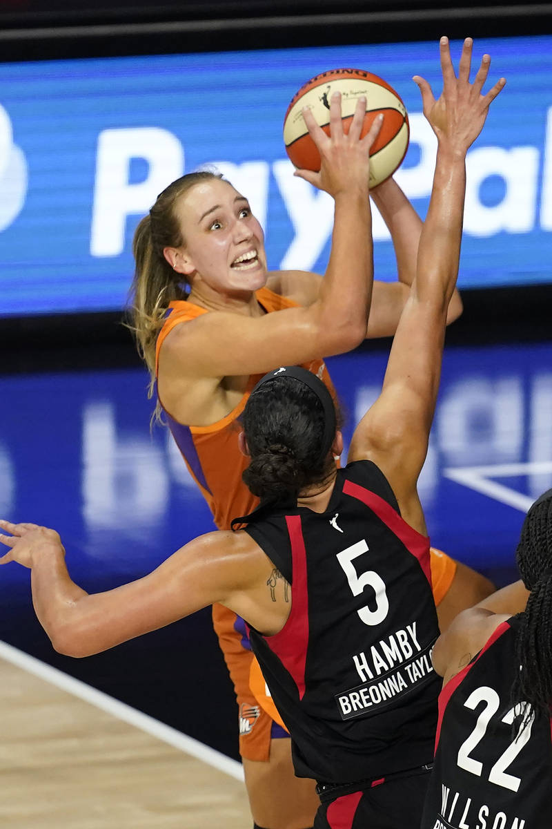 Phoenix Mercury forward Alanna Smith (11) shoots over Las Vegas Aces forward Dearica Hamby (5) ...