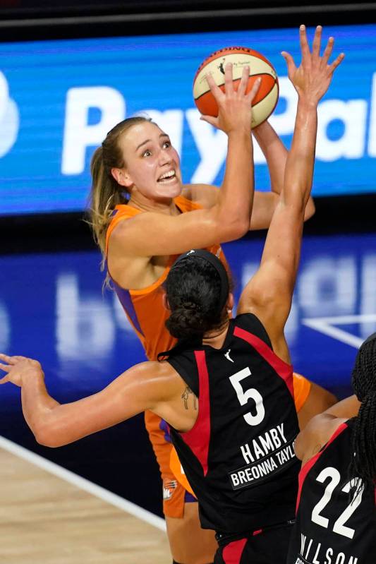 Phoenix Mercury forward Alanna Smith (11) shoots over Las Vegas Aces forward Dearica Hamby (5) ...