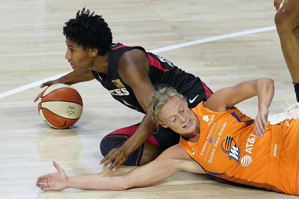 Las Vegas Aces forward Angel McCoughtry (35) beats Phoenix Mercury guard Sophie Cunningham (9) ...