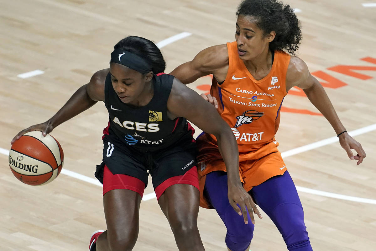 Las Vegas Aces guard Jackie Young beats Phoenix Mercury guard Skylar Diggins-Smith (4) to a loo ...