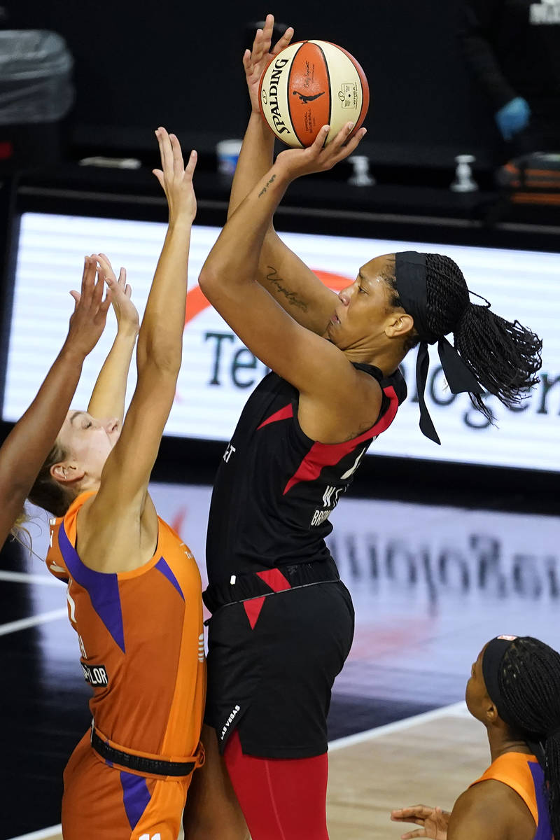 Las Vegas Aces center A'ja Wilson (22) shoots over Phoenix Mercury forward Alanna Smith (11) du ...