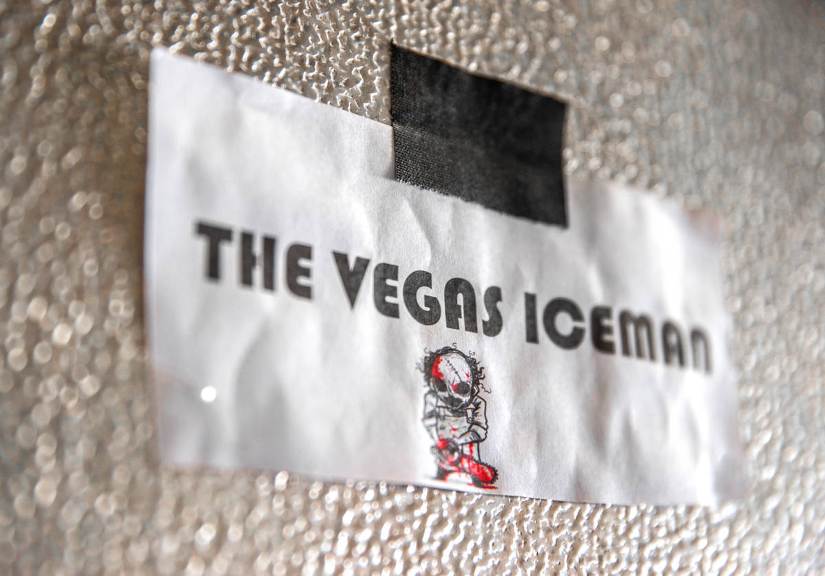 Stickers advertising Marco Villarreal's business line the freezer where he makes his ice sculpt ...