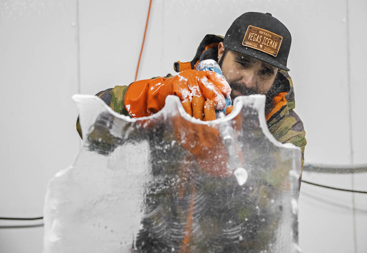 Marco Villarreal, known as "Vegas Ice Man," works on an ice sculpture on Tuesday, Sep ...