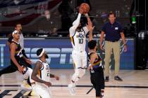 Utah Jazz's Mike Conley (10) attempts a shot in the final seconds of the second half of an NBA ...