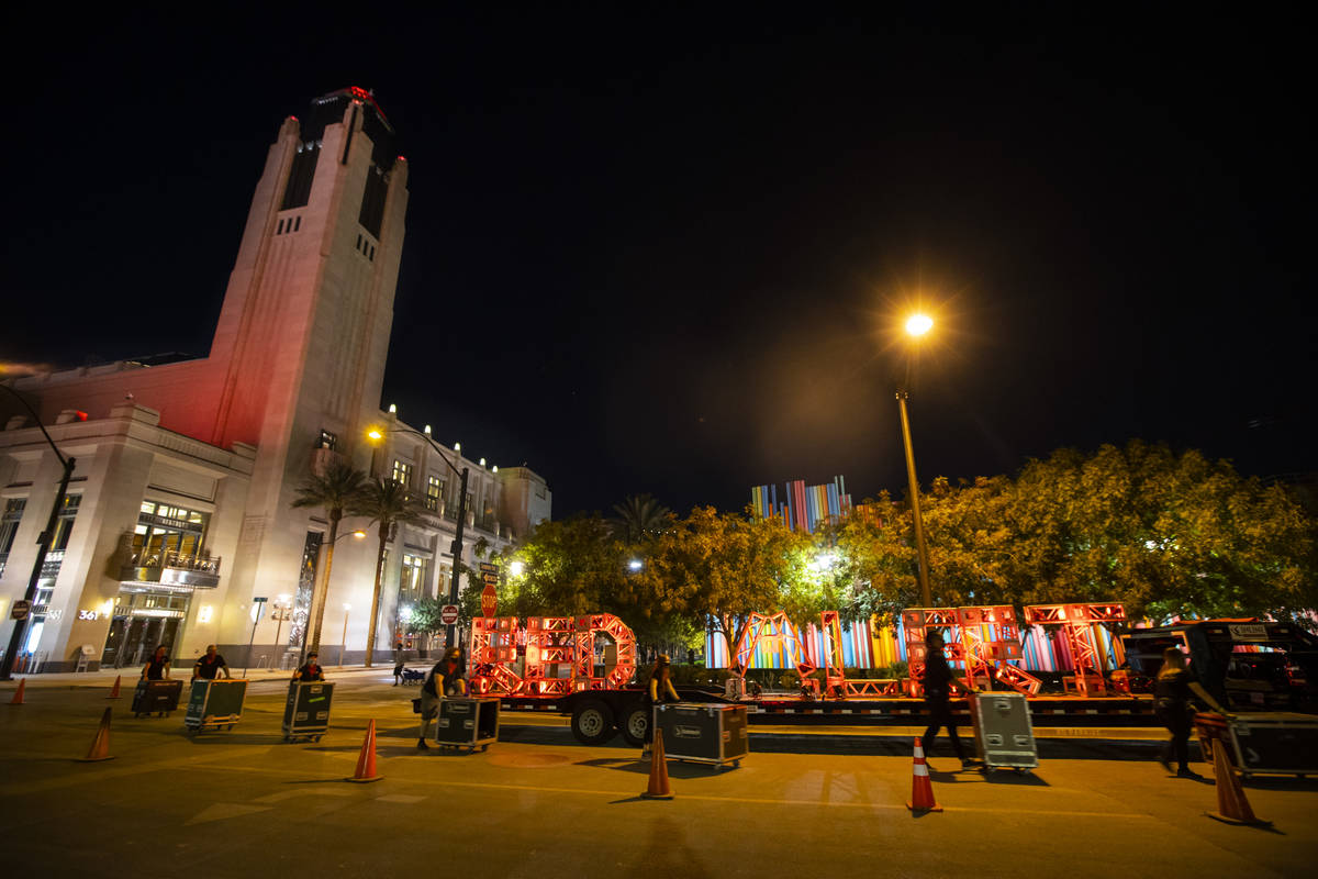 Entertainment workers push road cases past a "Red Alert" sign as The Smith Center tur ...
