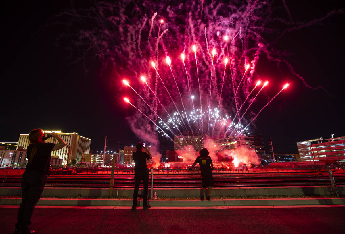 Entertainment workers watch as fireworks go off at the Core Arena at the Plaza for the "Re ...