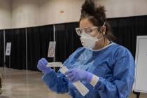 In this Aug. 3, 2020, file photo, UMC respiratory therapist Diana Vega prepares tests during a ...