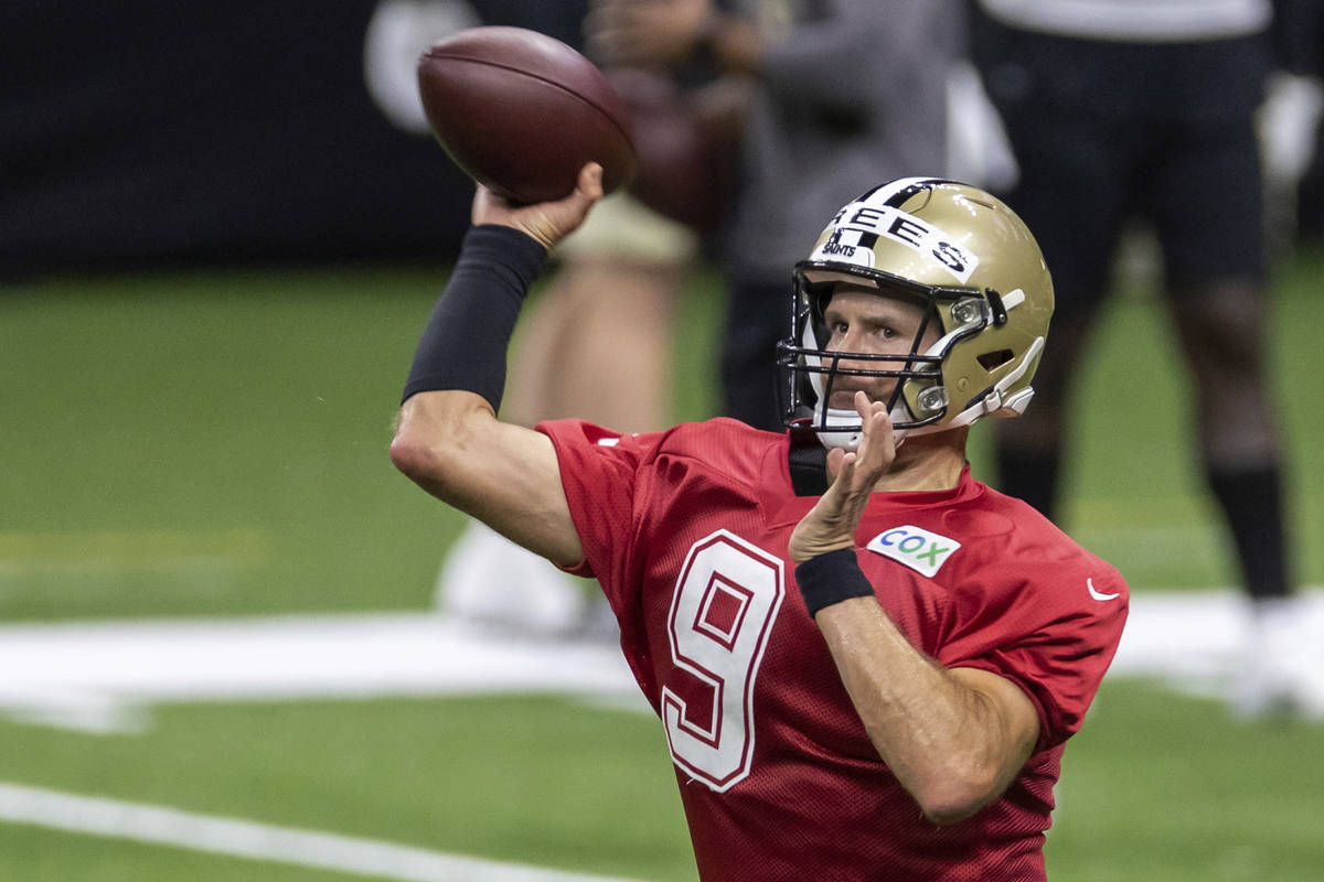 New Orleans Saints quarterback Drew Brees throws the ball during NFL football training camp Sat ...