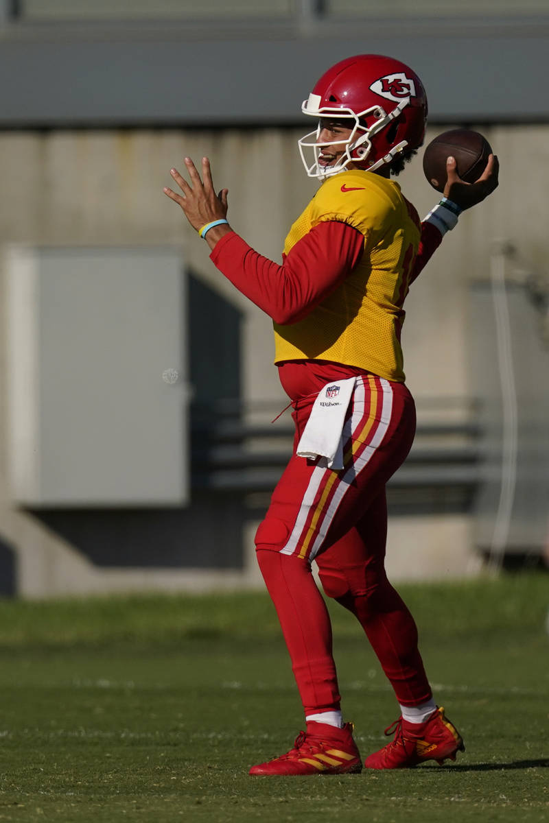 Kansas City Chiefs quarterback Patrick Mahomes throws during an NFL football training camp prac ...
