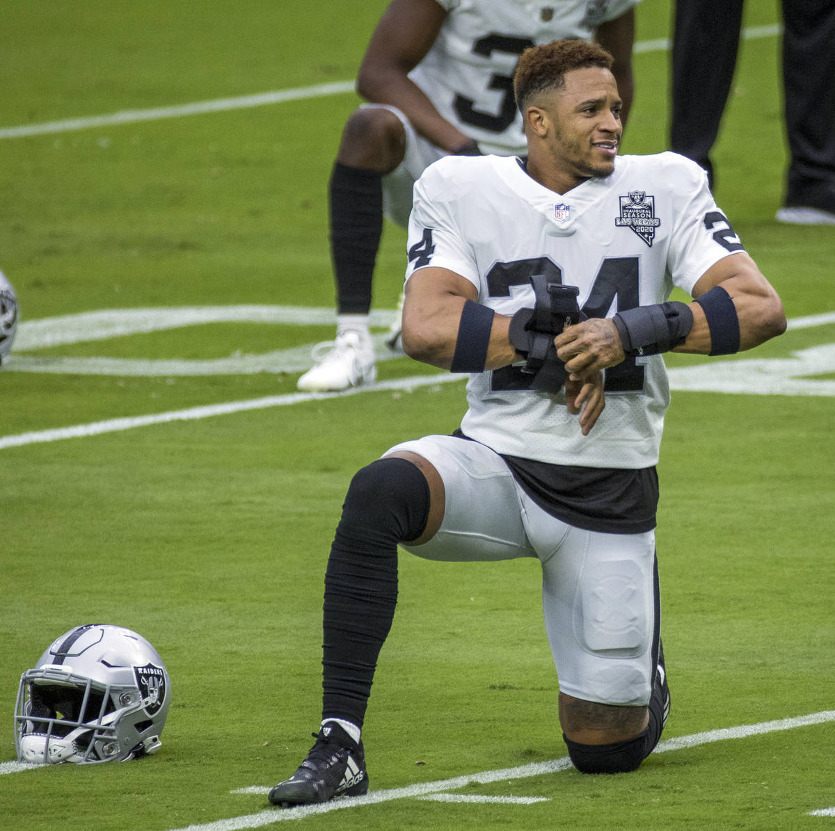 Las Vegas Raiders safety Johnathan Abram (24) stretches with teammates during a Las Vegas Raide ...