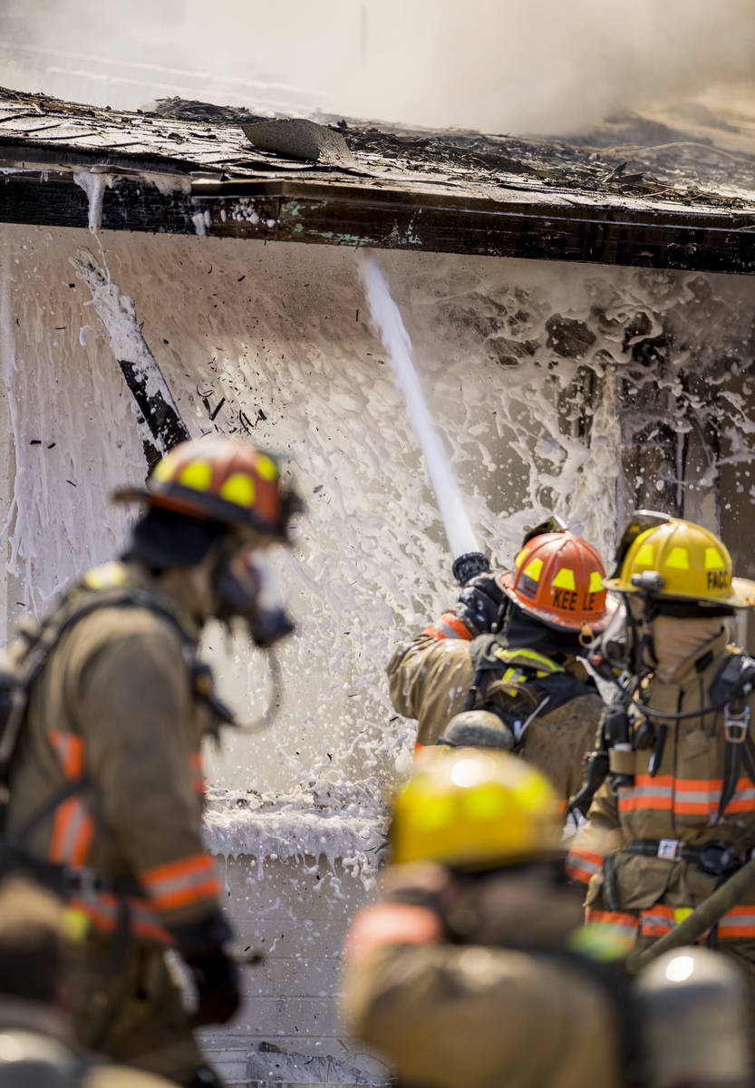 Las Vegas firefighters battle a house fire on 5400 block of West Pebble Beach Boulevard on Wedn ...