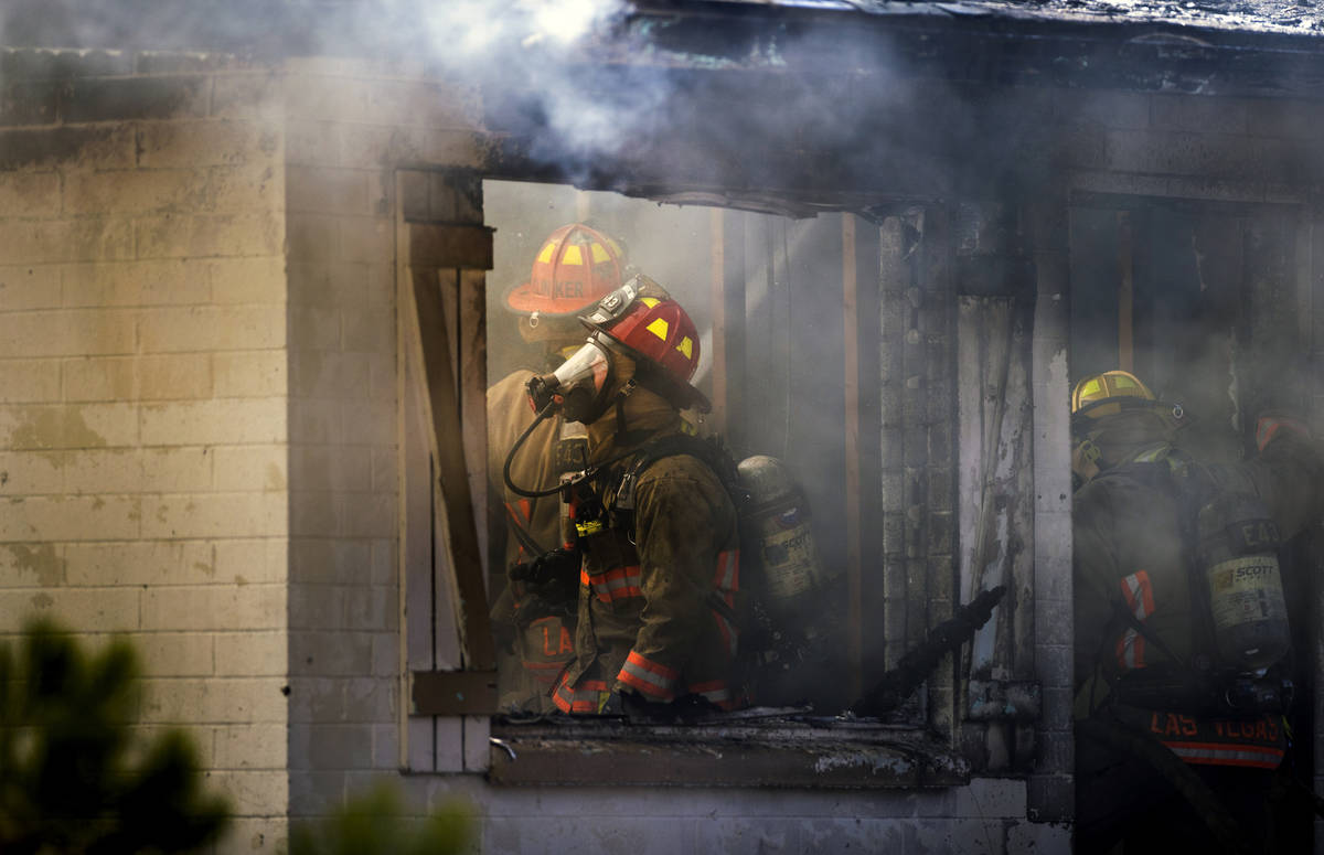 Las Vegas firefighters battle a house fire on 5400 block of West Pebble Beach Boulevard on Wedn ...