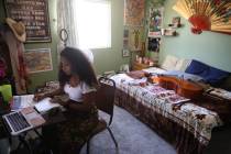 Orchestra teacher Coco Jenkins Thomas teaches students from her home in Las Vegas, Thursday, Ma ...