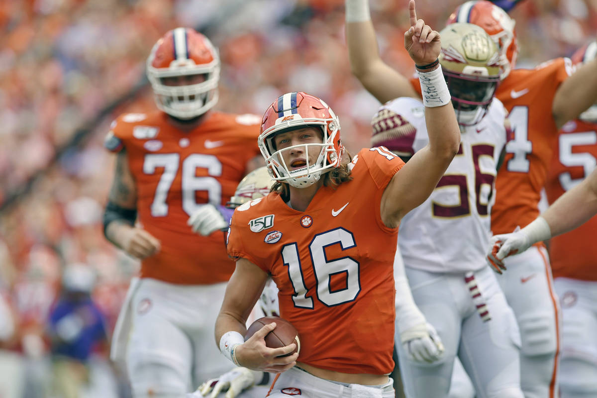 FILE - In this Oct. 12, 2019, filer photo, Clemson quarterback Trevor Lawrence (16) reacts afte ...