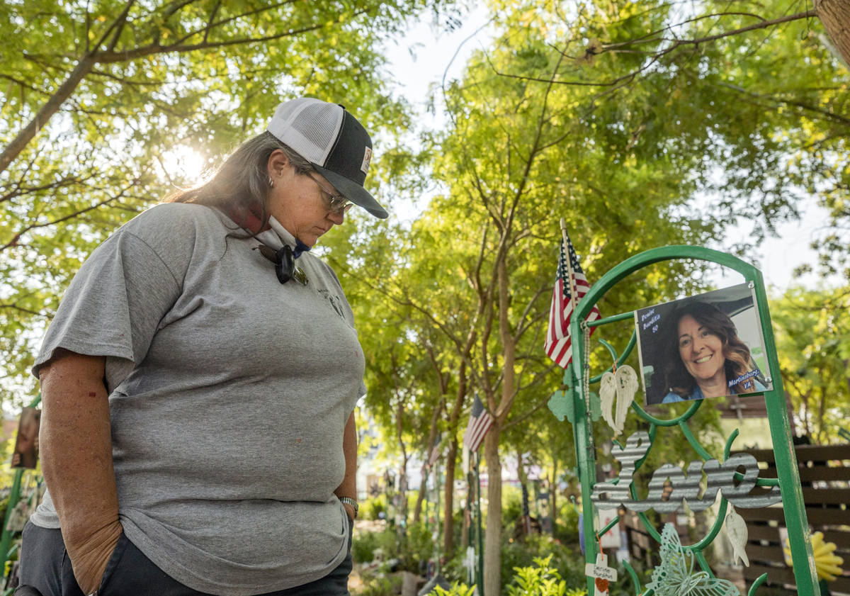 Survivor of Route 91 and caretaker of the Las Vegas Healing Garden Sue Ann Cornwell looks at Ro ...