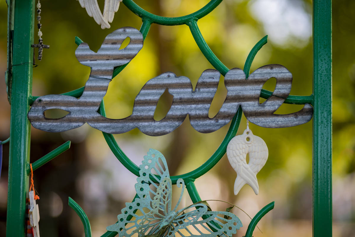 Relics seen adorning memorial trellises for victims of Route 91, at the Las Vegas Healing Garde ...