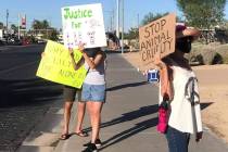 Protesters were in front of North Las Vegas City Hall on Wednesday to ask for felony charges ag ...