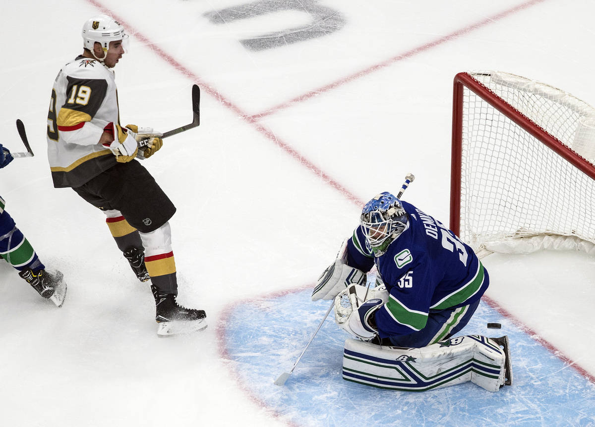 Vancouver Canucks goalie Thatcher Demko (35) makes a save against Vegas Golden Knights' Reilly ...