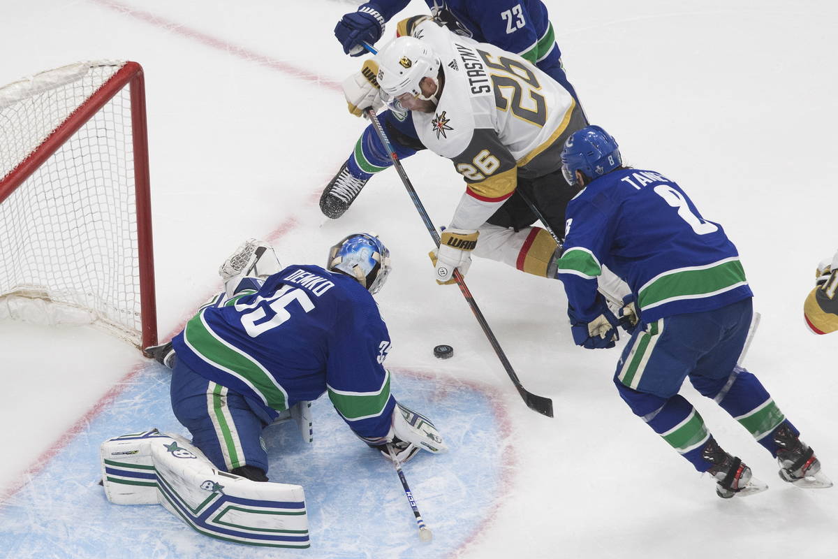 Vancouver Canucks goalie Thatcher Demko (35) makes a save on Vegas Golden Knights' Paul Stastny ...