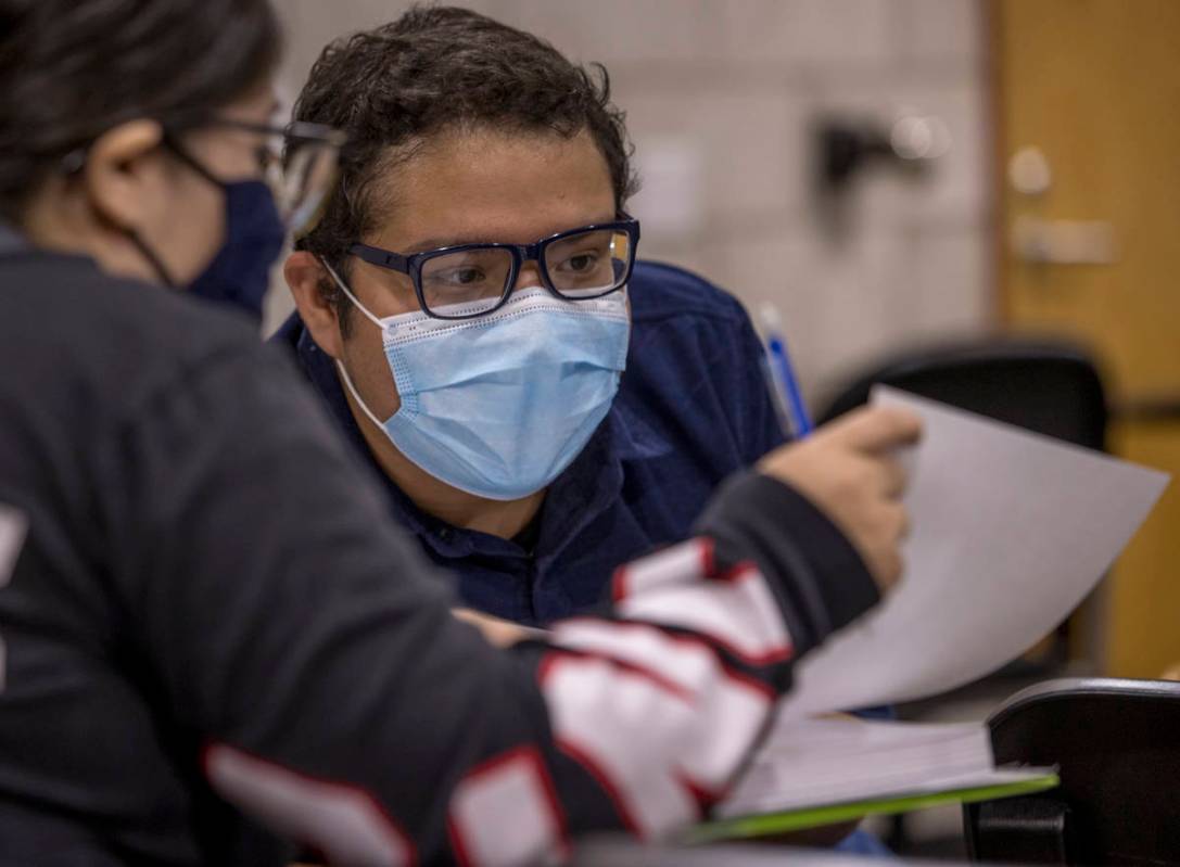 UNLV pre-nursing freshman Jorge "Fabian" Trejo-Ibarra, right, works on a problem with fellow st ...