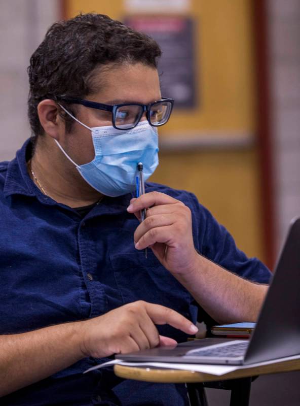 UNLV pre-nursing freshman Jorge "Fabian" Trejo-Ibarra works on a math problem in professor Bob ...