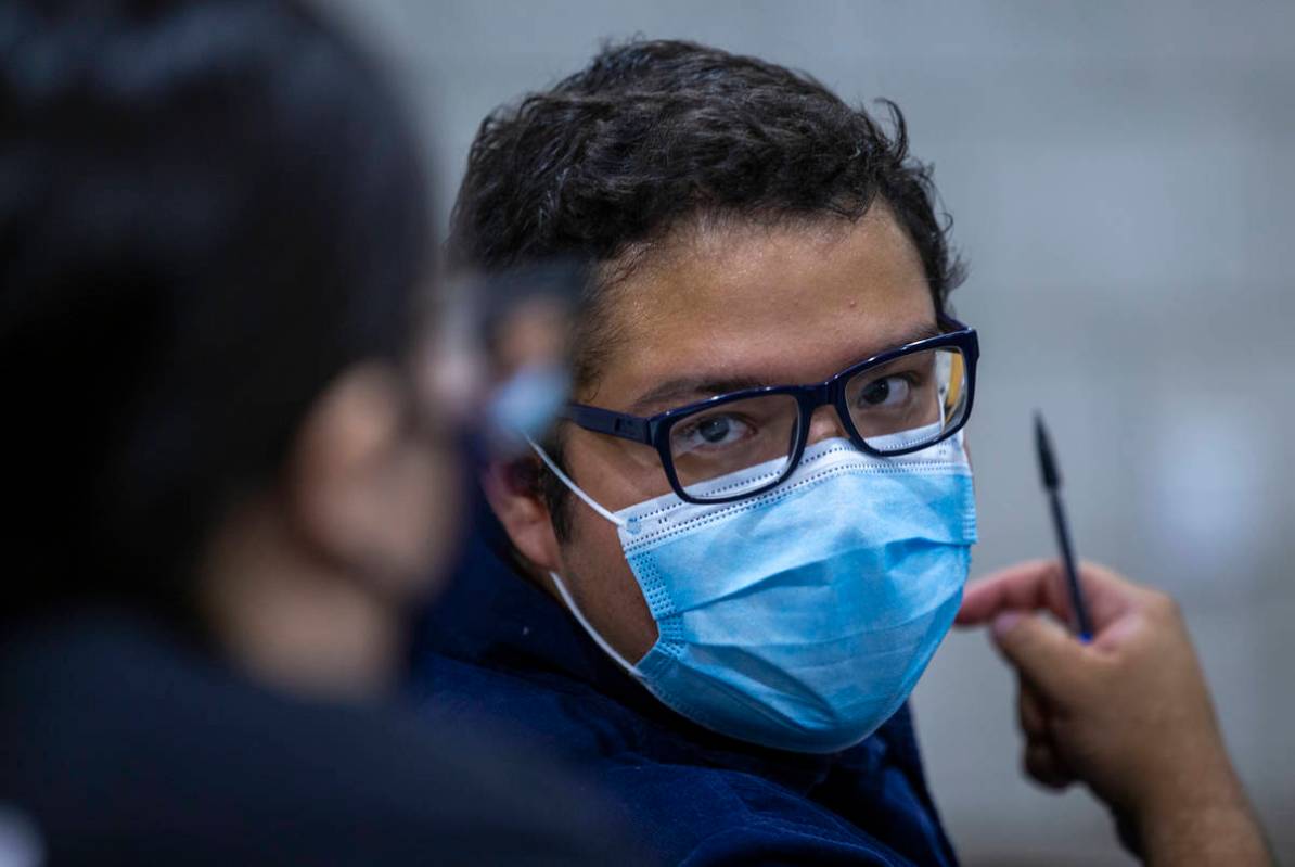 UNLV pre-nursing freshman Jorge "Fabian" Trejo-Ibarra, right, works on a problem with fellow st ...