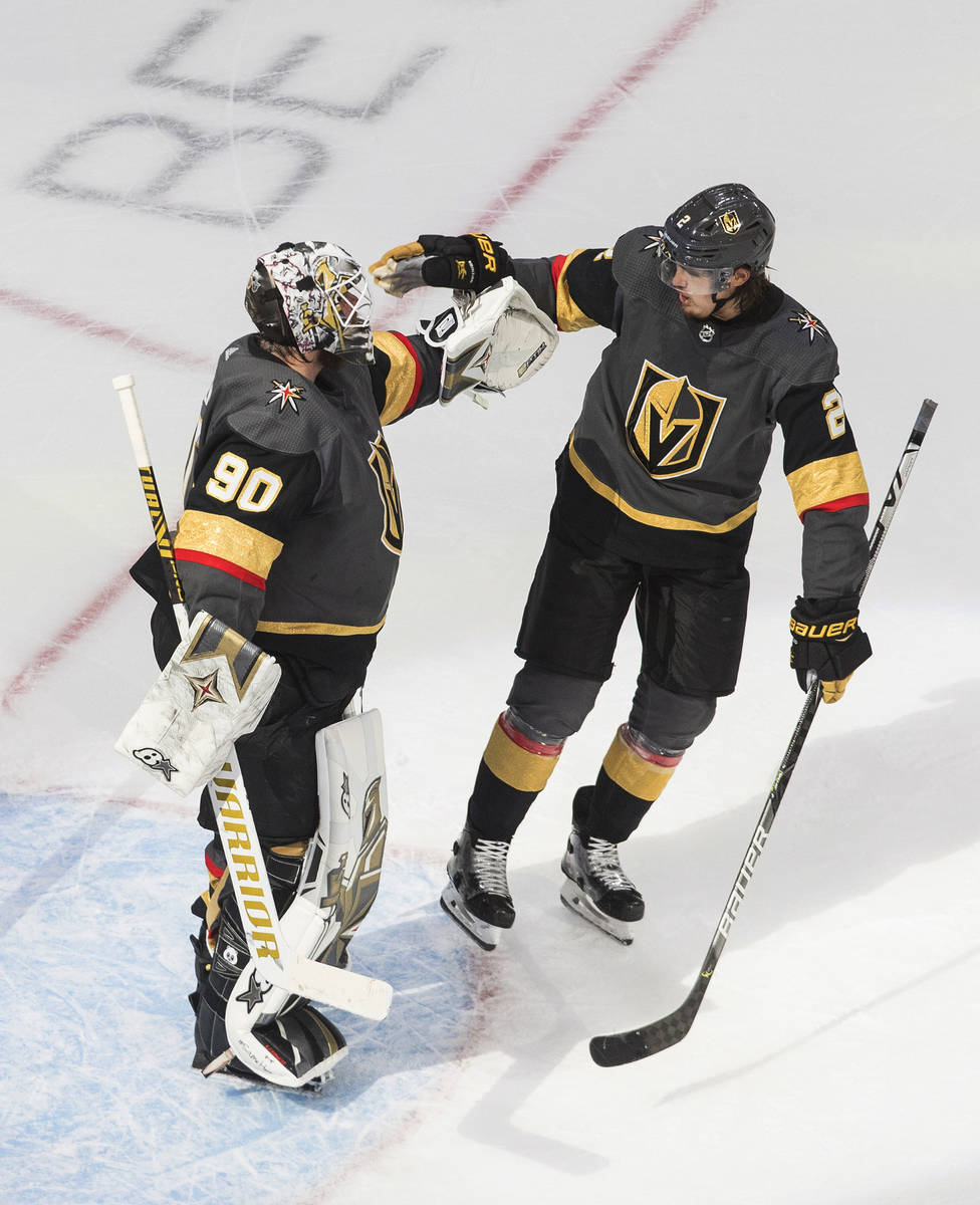 Vegas Golden Knights goalie Robin Lehner (90) and teammate Zach Whitecloud (2) celebrate the Go ...