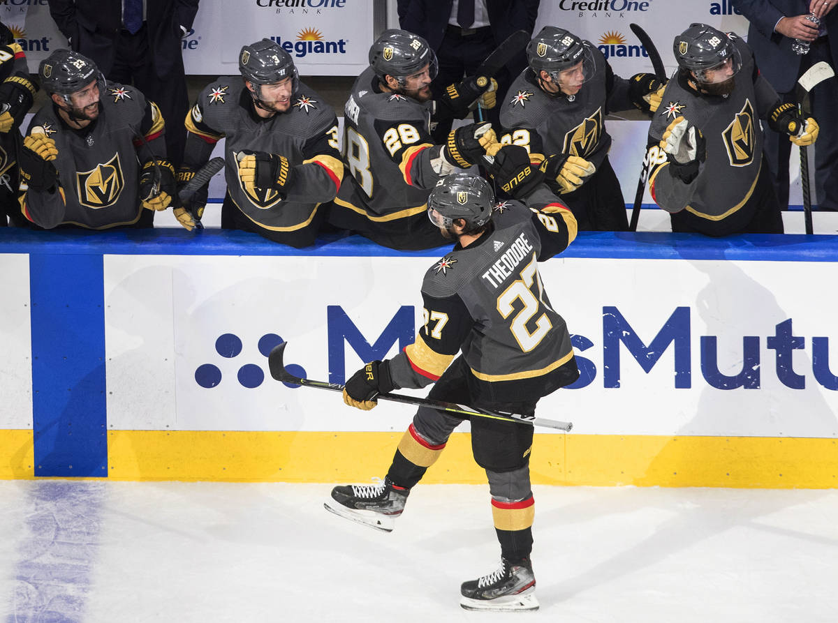 Vegas Golden Knights' Shea Theodore (27) is congratulated for his goal against the Vancouver Ca ...