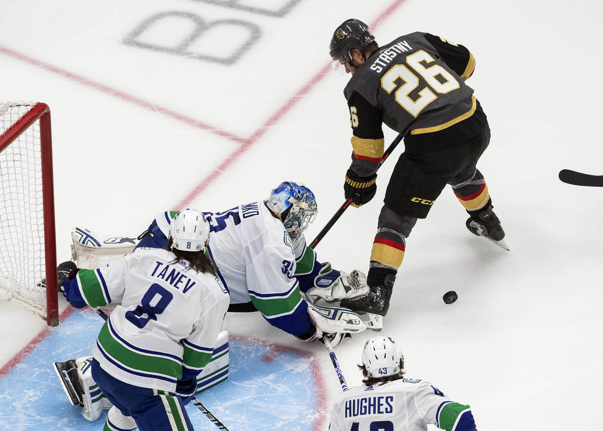 Vancouver Canucks goalie Thatcher Demko (35) makes a save against Vegas Golden Knights' Paul St ...