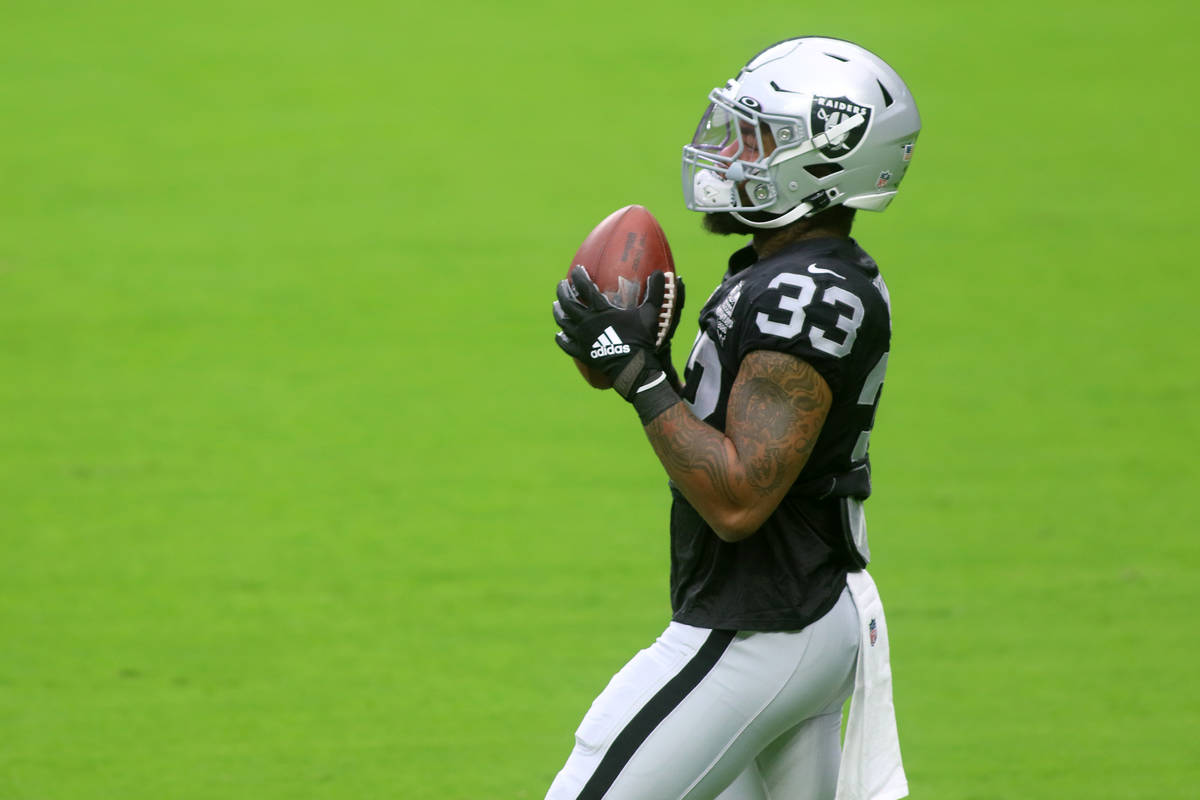 Las Vegas Raiders running back Lynn Bowden Jr. (33) catches the football during a team practice ...