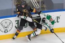 Dallas Stars' Mattias Janmark (13) is checked by Vegas Golden Knights' Brayden McNabb (3) durin ...
