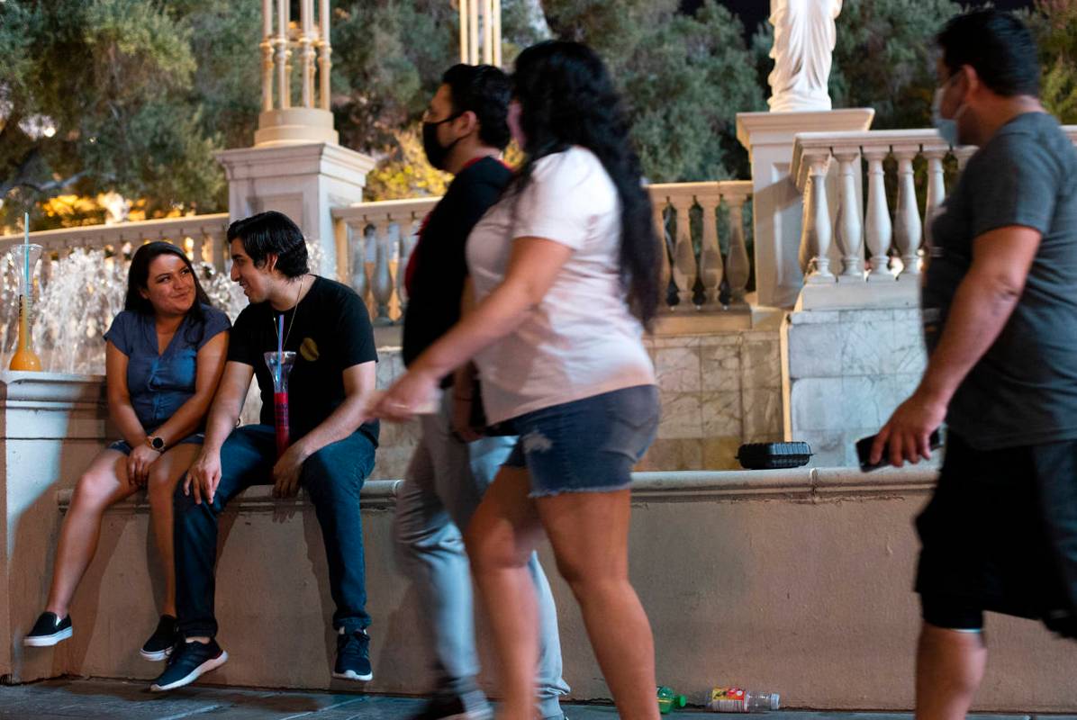 California couple Kristina Cruz and Hector Echeverria, left, share a moment outside Caesars Pal ...
