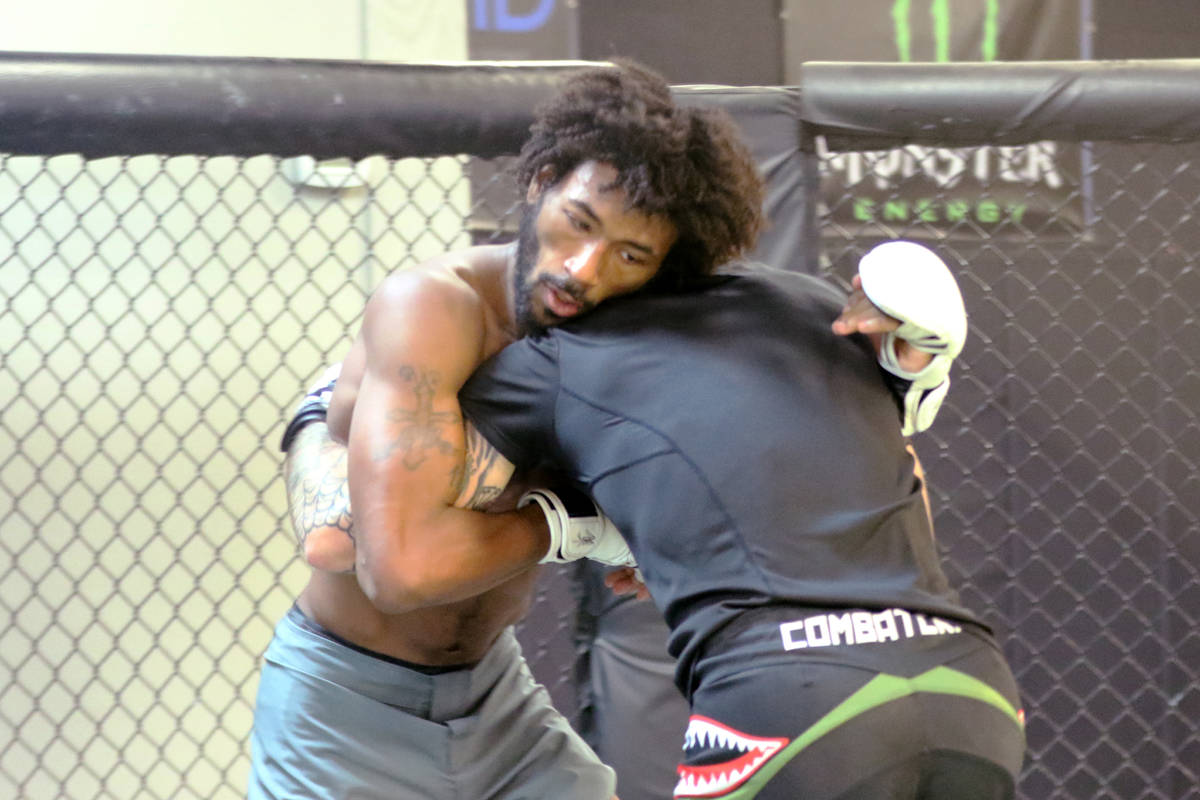 Sherrard Blackledge, left, clinches with Sasha Palatnikov during a sparring session at Syndicat ...