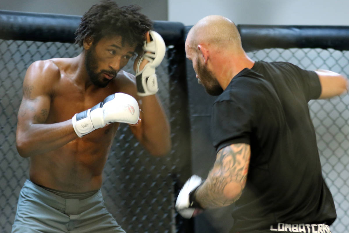 Sherrard Blackledge, left, spars with Sasha Palatnikov during a training session at Syndicate M ...