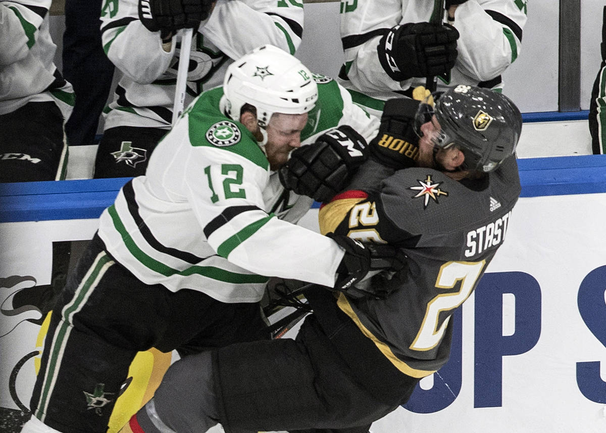 Vegas Golden Knights' Paul Stastny (26) is checked by Dallas Stars' Radek Faksa (12) during the ...
