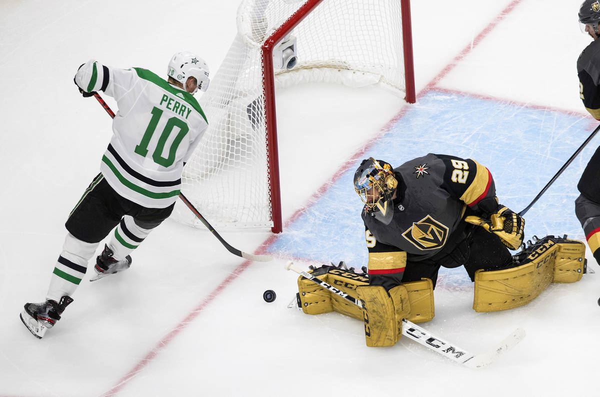 Vegas Golden Knights goalie Marc-Andre Fleury (29) stops Dallas Stars' Corey Perry (10) during ...