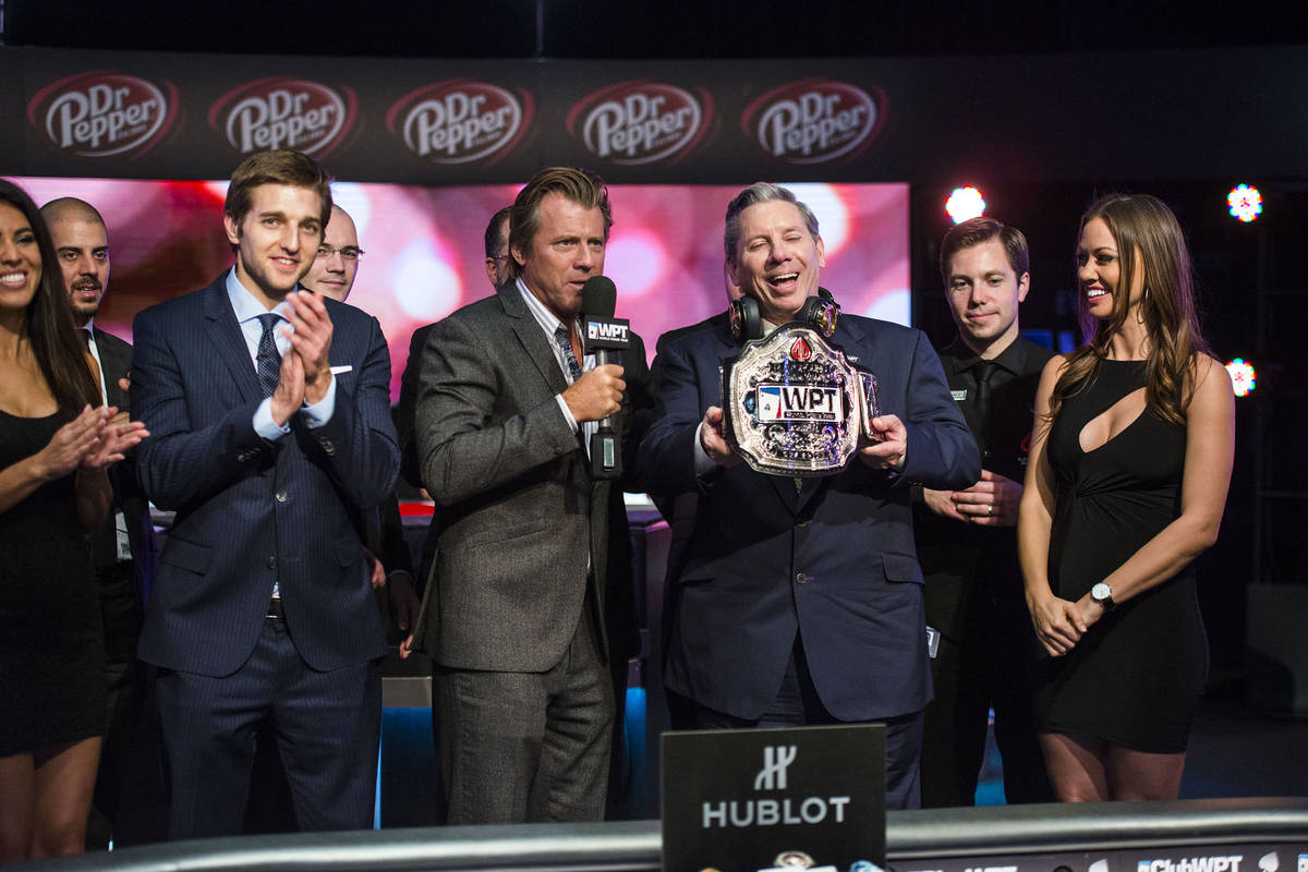 Mike Sexton receives his champion's belt after winning a World Poker Tour event in Montreal in ...