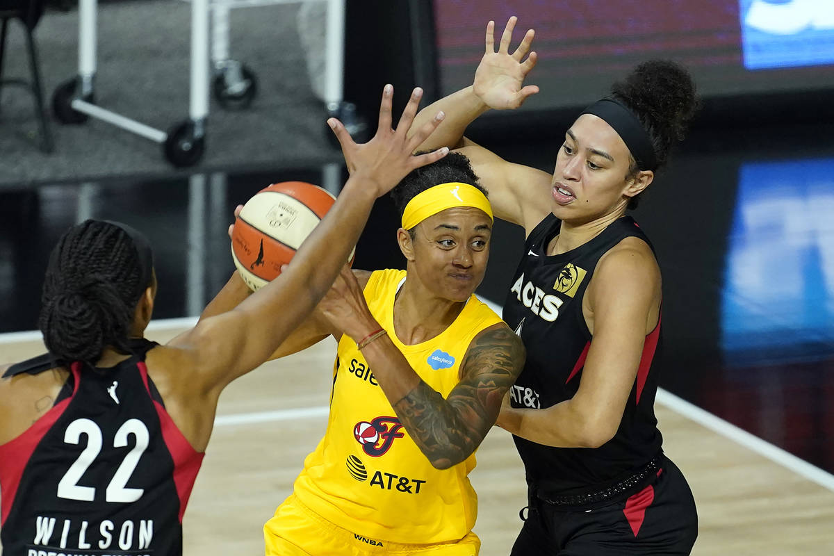 Indiana Fever forward Candice Dupree (4) shoots between Las Vegas Aces forward Dearica Hamby (5 ...