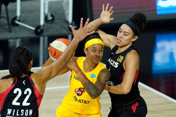 Indiana Fever forward Candice Dupree (4) shoots between Las Vegas Aces forward Dearica Hamby (5 ...