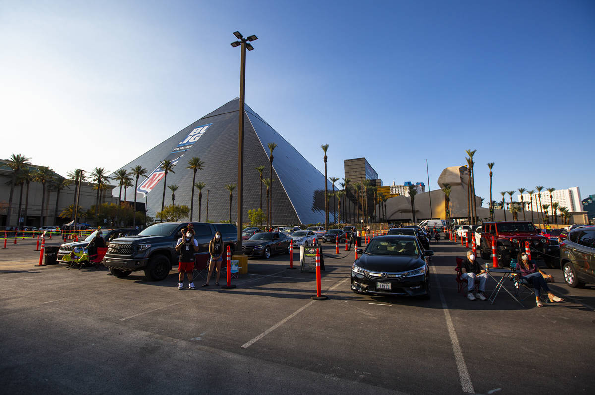 Las Vegas Aces fans cheer at the start of a drive-in showing of the Las Vegas Aces WNBA game ag ...