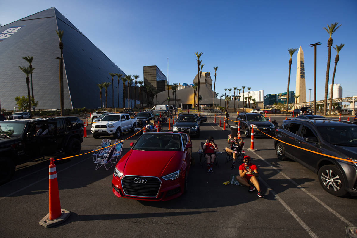 Las Vegas Aces fans cheer during a drive-in showing of the Las Vegas Aces WNBA game against the ...