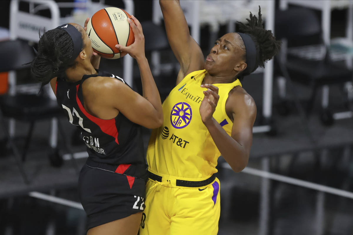 Las Vegas Aces' A'ja Wilson (22) shoots against Los Angeles Sparks' Nneka Ogwumike during the s ...