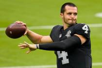 Las Vegas Raiders quarterback Derek Carr (4) throws a pass during an NFL football training camp ...