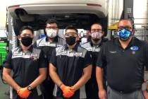 Findlay Volkswagen service director John Gonzalez poses with a few of his current technicians. ...
