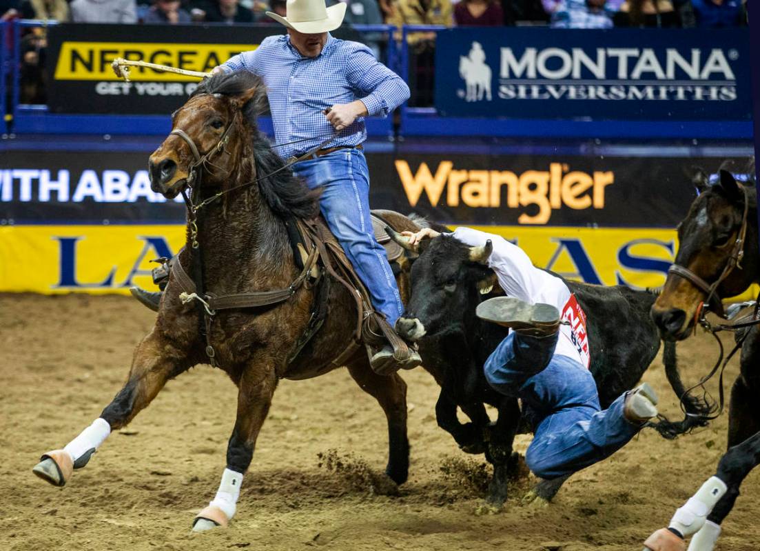 J.D. Struxness of Milan, Minn., mistimes the leap in Steer Wrestling during the tenth go round ...